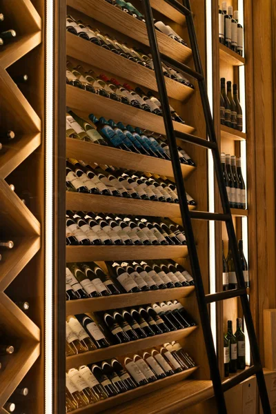wall shelves stocked with wine image